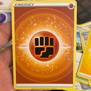 Pokemon Fighting Energy Card with Orange and Black